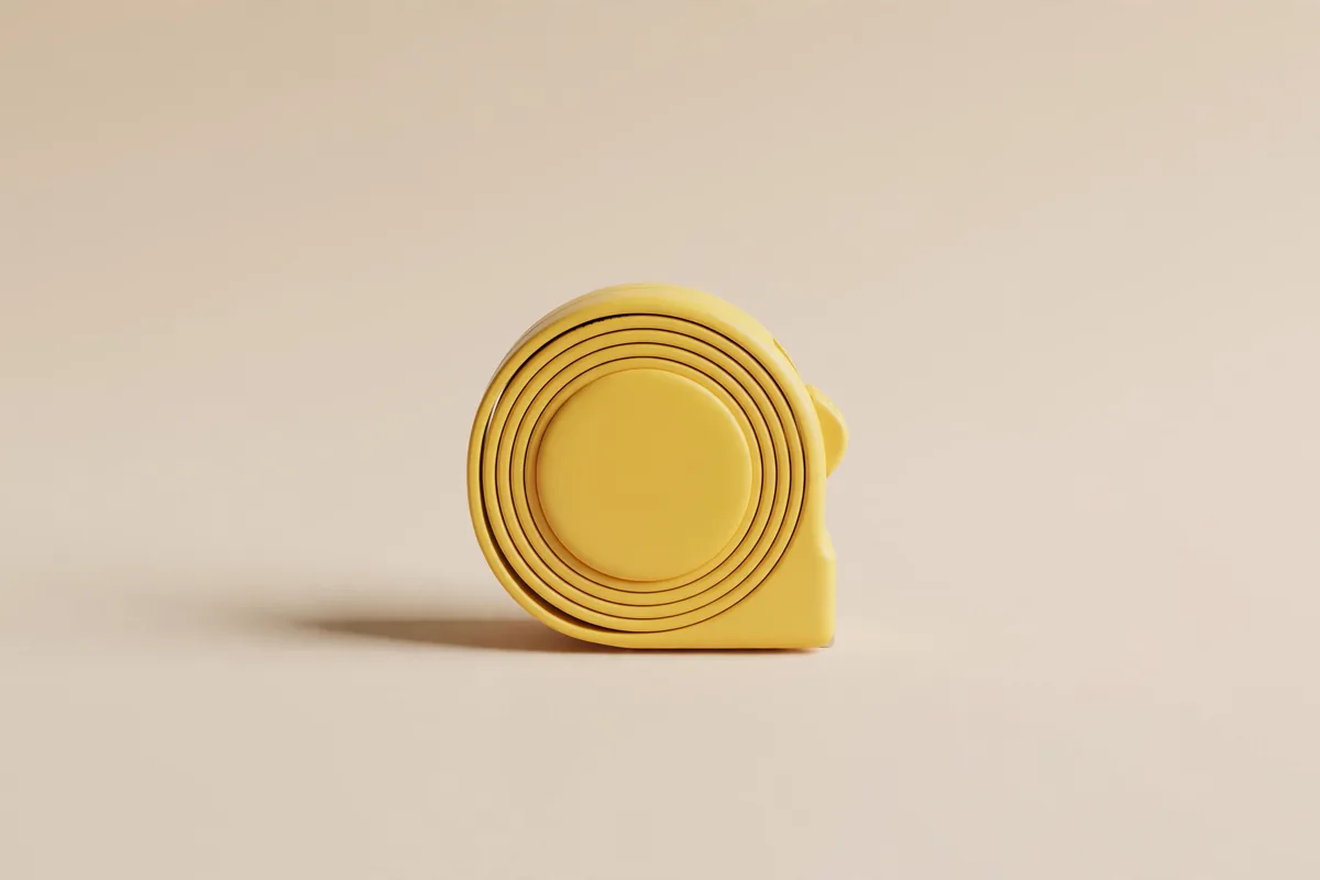 A yellow tape measure rolled up